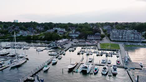 Aerial-flyover-of-bay-marina-on-public-dock-with-many-boats-and-yachts