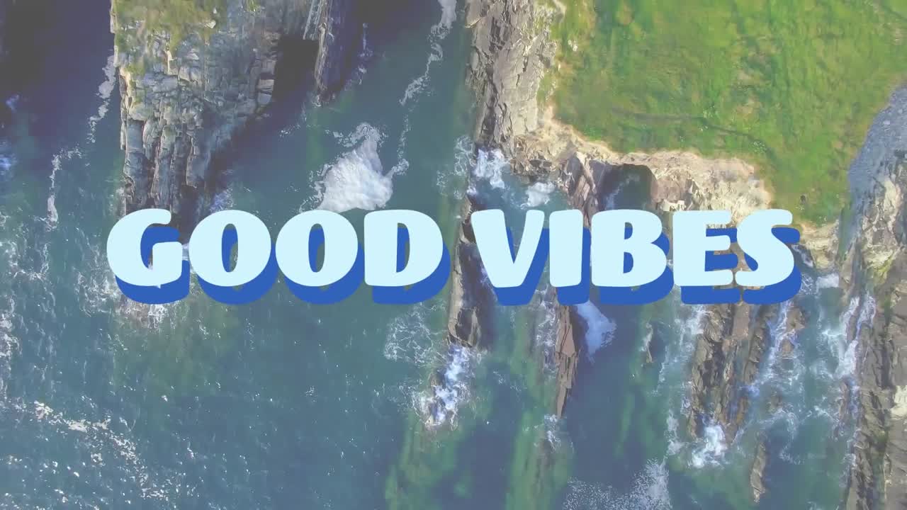 Animation of the words good vibes in pale blue with aerial of timelapse clouds over countryside