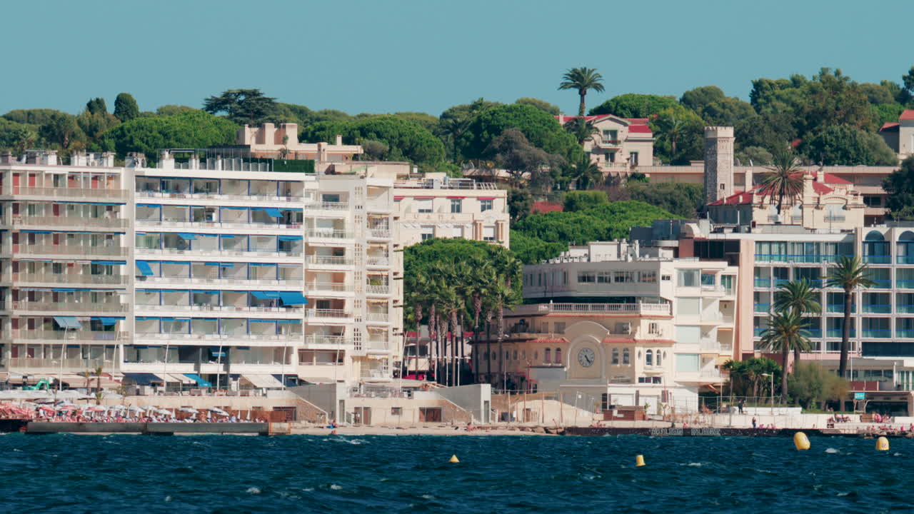 Cannes, France - October 6, 2025: View of seaside hotels, palm trees, and beachfront apartments