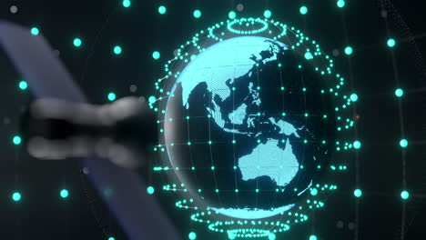 animation of glowing blue mesh of connections over globe on black background