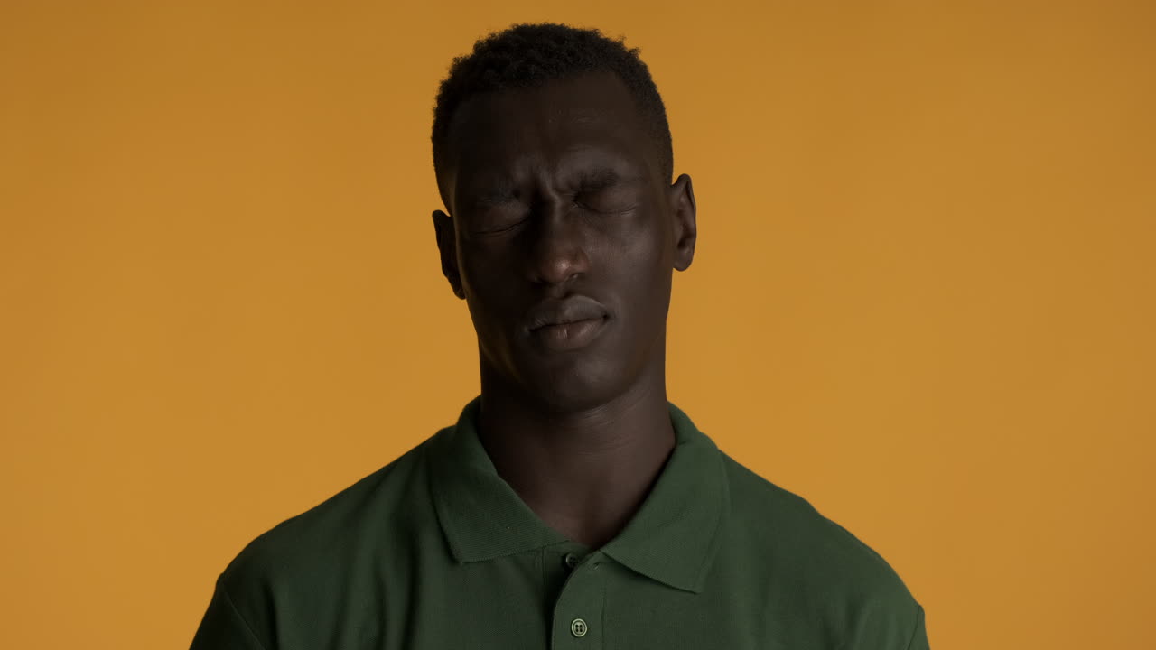 African american man on yellow background.