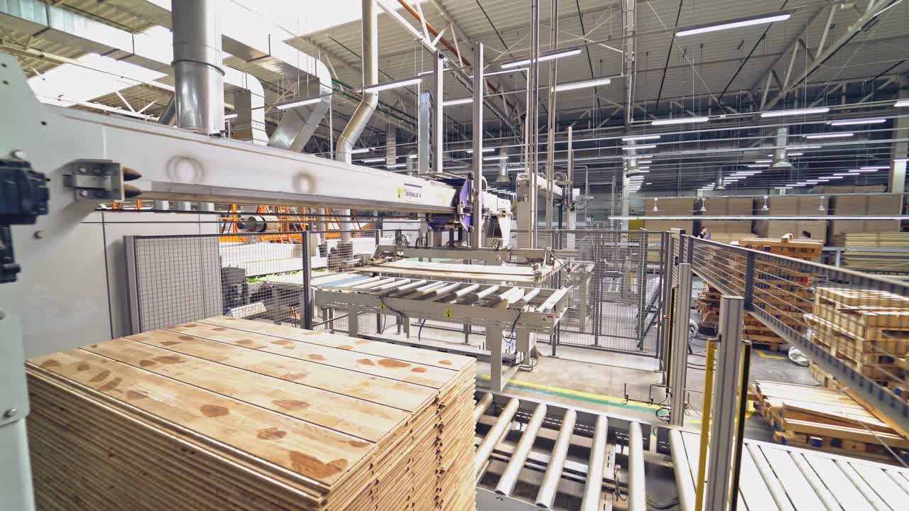 Modern equipment for automating wood processing at the factory. Making parquet with the help of robotic technology and people.