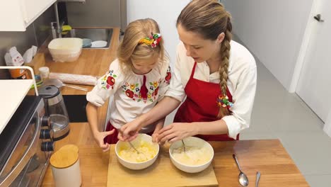 mother and daughter baking together