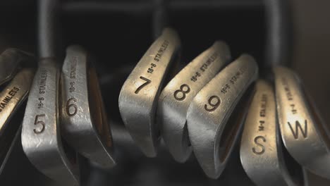 static shot of a range of golf irons and wedge clubs in a golf bag