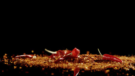 red chili falling on chili flakes 4k