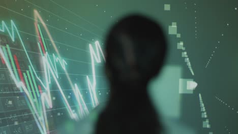 woman visiting immersive art exhibition with projection of financial data with graphs and share prices 3