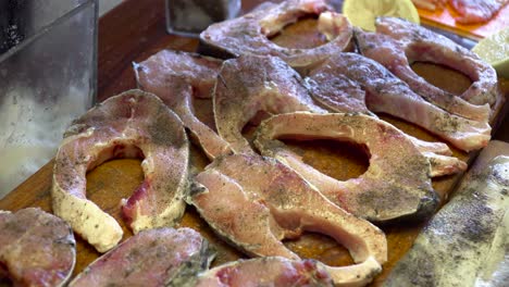 static shot of pieces of carp being seasoned, slovak christmas tradition