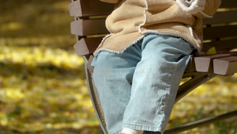 child eating lollipop in a park