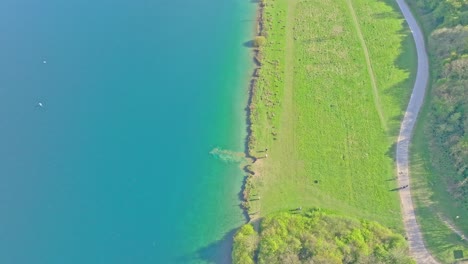 aerial: lake during the day in rother valley country park in the metropolitan borough of rotherham, south yorkshire, england, crane down drone shot