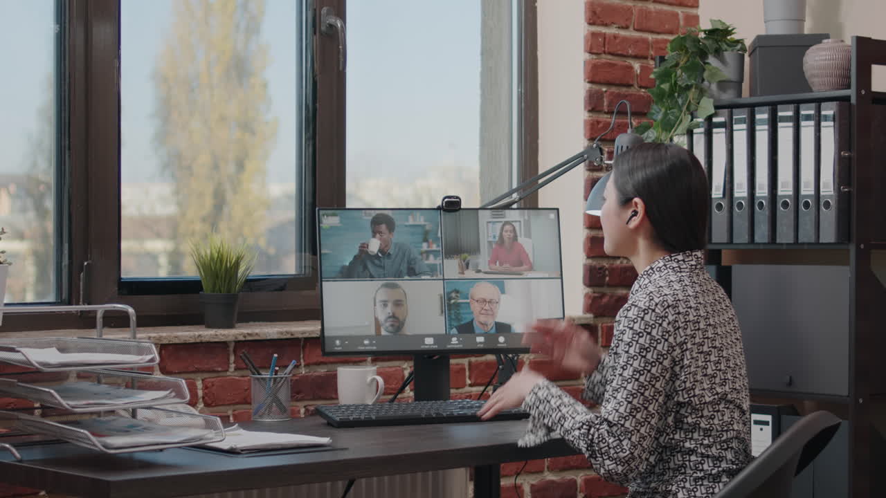 Woman attending video call business meeting online