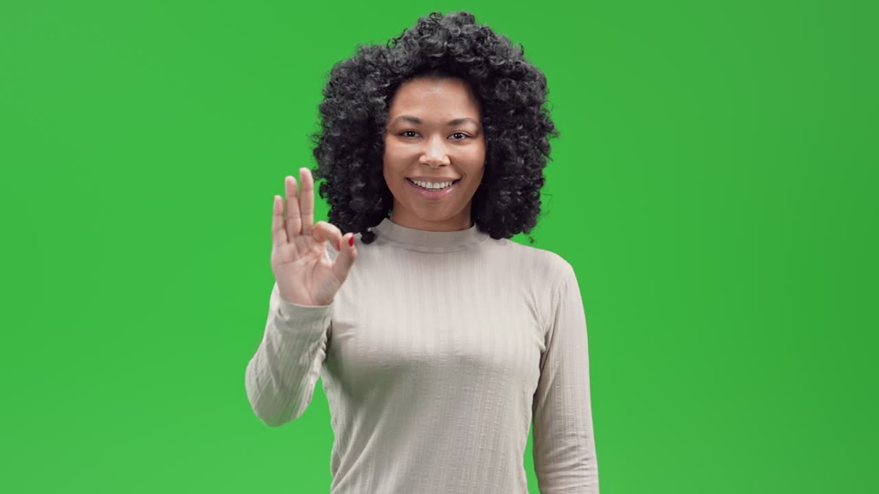 Green Screen young african female shows ring gesture