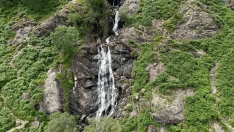 drone aerial footage of the taylor gill force waterfall at borrowdale, seathwaite and is one of the highest waterfalls, in the lake district national park