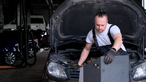 mechanic working on a car in a professional garage