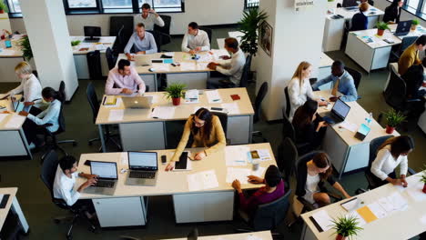 busy office environment with people working