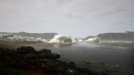 gigantic ice block structures on the black sand by the sea shore