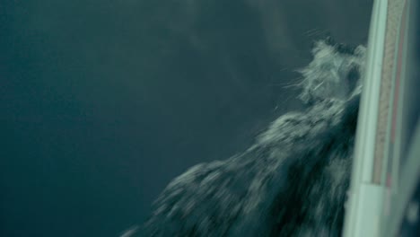 close-up of water hitting a boat as it goes through the lake