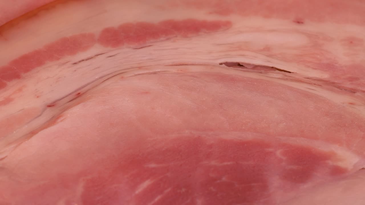 Macro shot of boiled ham slice, close up view in 4k