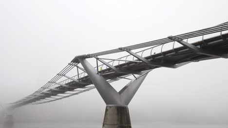 london's millennium bridge on a foggy morning