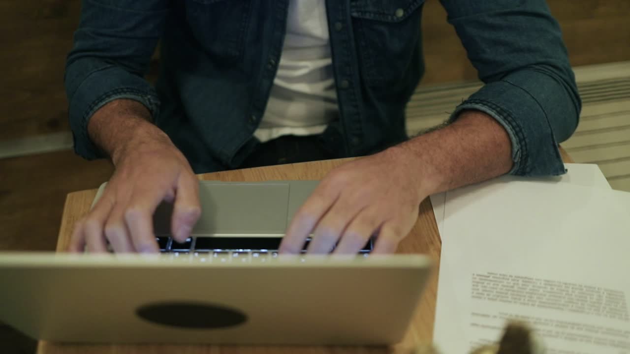 Young freelancer working with laptop computer in cafe