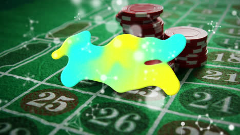 animation of glowing blob with molecules over casino gambling board