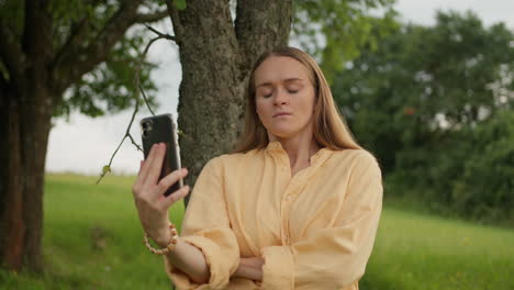 young woman, mobile phone, video call, being angry