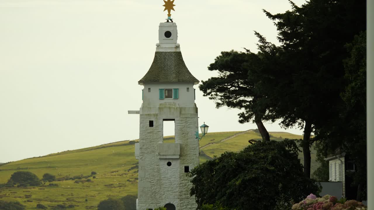 Lighthouse On The Coast Of Portmeirion, An Italian Style Village In North Wales, UK
