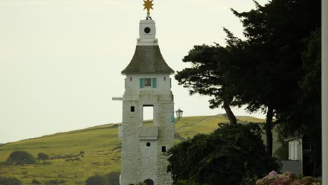 lighthouse on the coast of portmeirion, an italian style village in north wales, uk
