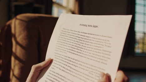 reading a letter indoors