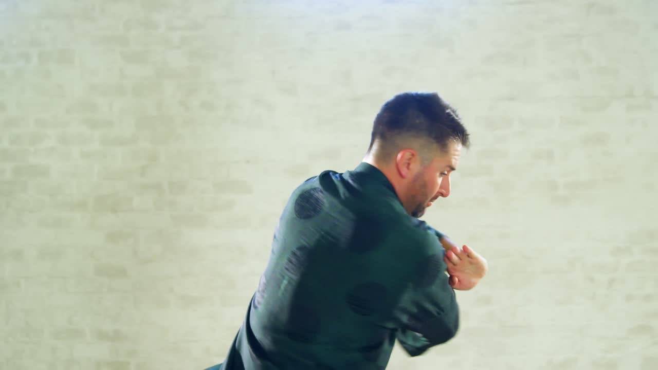 Kung fu fighter practicing martial arts with sword 4k