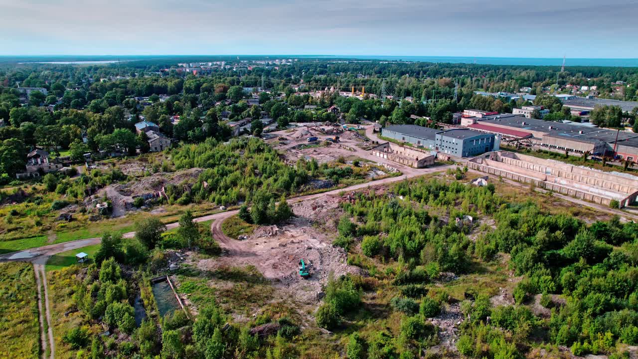Aerial view of industrial area and greenery in Latvia