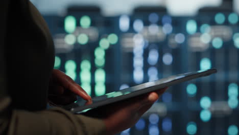 data center programmer uses tablet to develop disaster recovery plans
