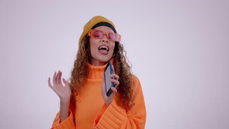 young woman, cellphone and singing in studio