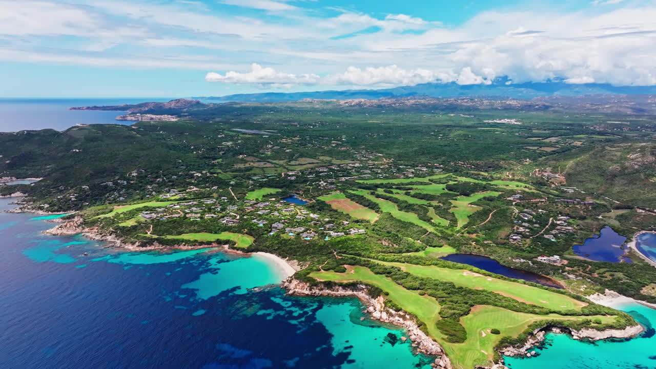 Aerial drone view of beautiful coastline of Corsica, France. High view of the colorful turquoise sea and the picturesque green landscape. Bird's eye view of the beaches. Summer holidays destination