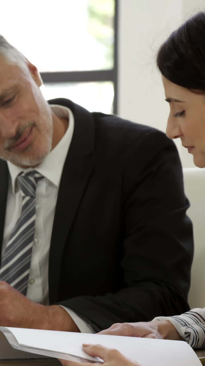 Business people speaking during a meeting
