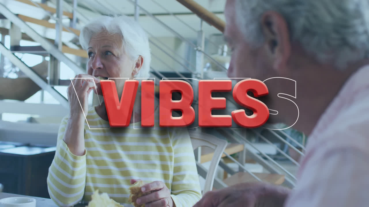 Animation of vibes text in red, over happy caucasian senior couple talking and eating at home
