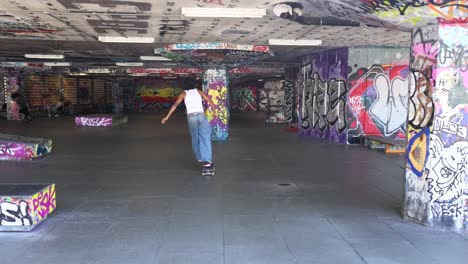 a skateboarder performs tricks in a vibrant skatepark