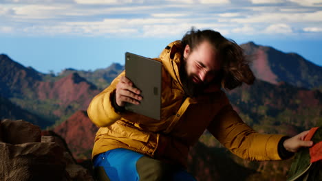 tech dependent hiker ignores the beauty of nature and works online