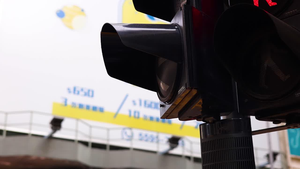 Traffic light changes, cars and pedestrians in Hong Kong