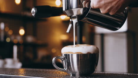 pouring milk to create latte art