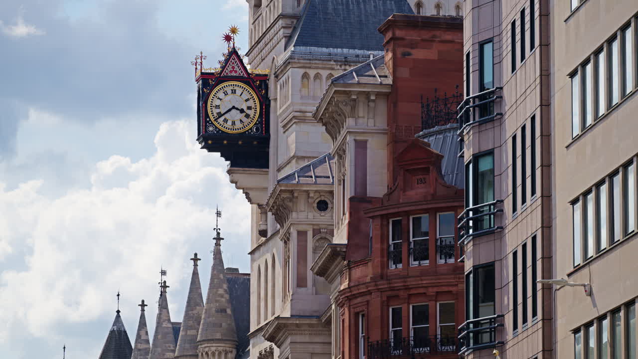 Street view of the clock tower and of the Royal Courts of Justice in London, England
