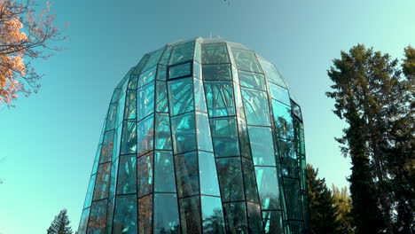 renovated glass exterior of palm house at oliwski park in gdańsk, poland