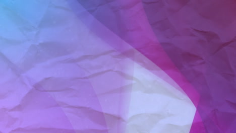 animation of purple and blue circles moving on crumpled white paper