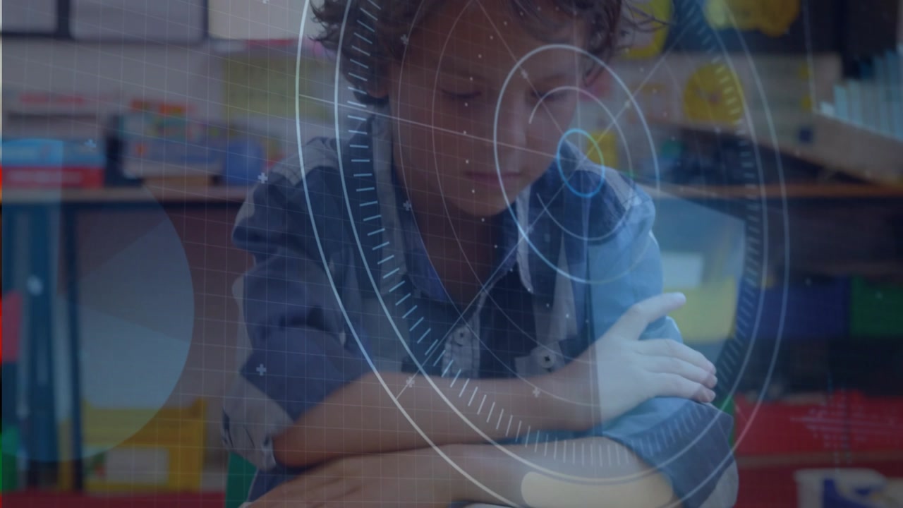 Boy reading open book in classroom, turning page to continue learning while HUD highlighting text