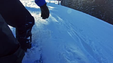 male snowboarder going down the ski trail