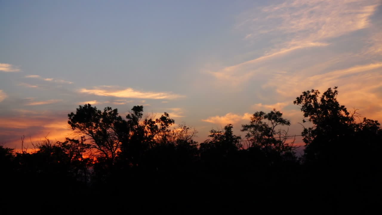 The movement of the train at a sunset. Shooting in the movement