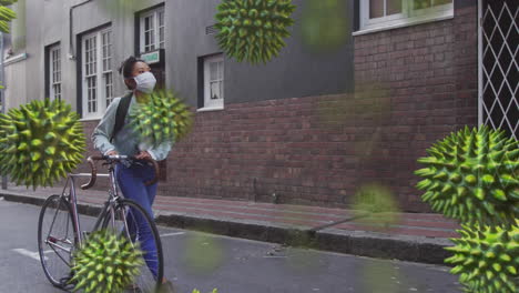 animation of macro virus and coronavirus covid-19 cells spreading over woman wearing a mask