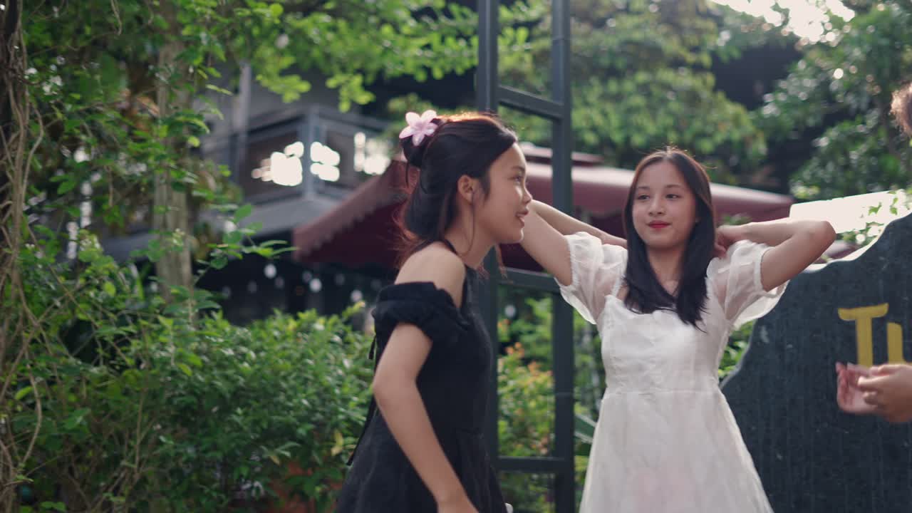 Teenage girls enjoying conversation in a park