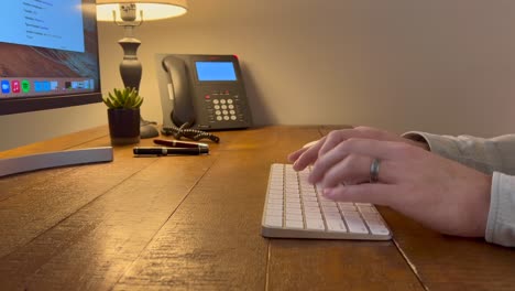 Trendy-office-desk-with-white-male-typing