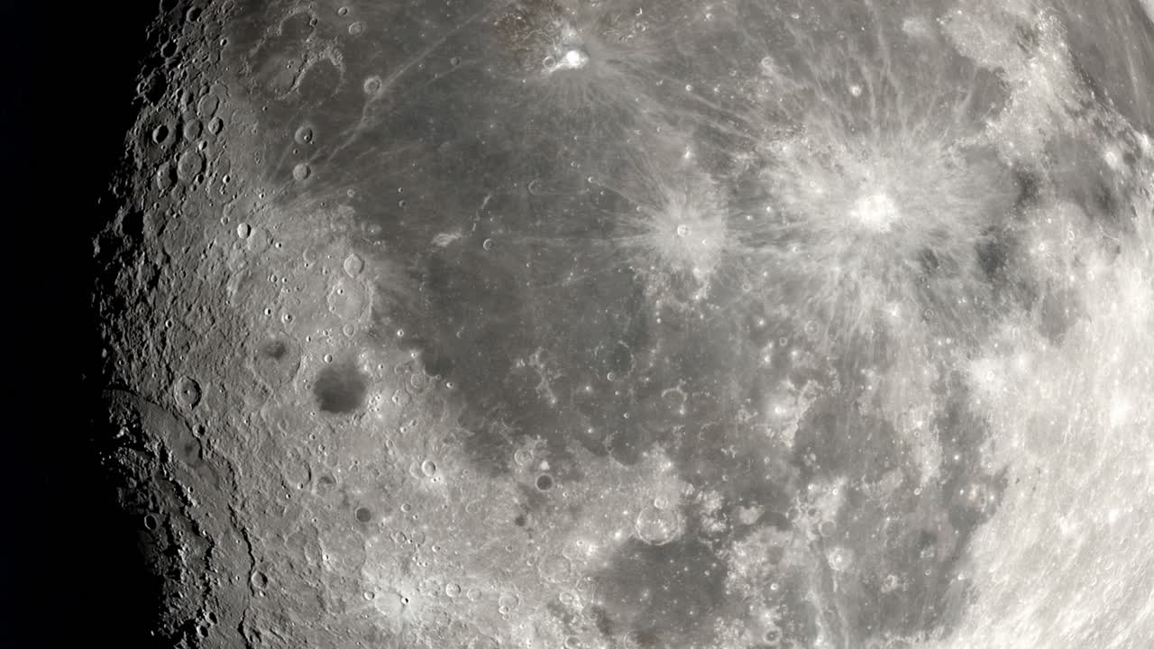 A 4K close-up of the lunar surface in rotation.