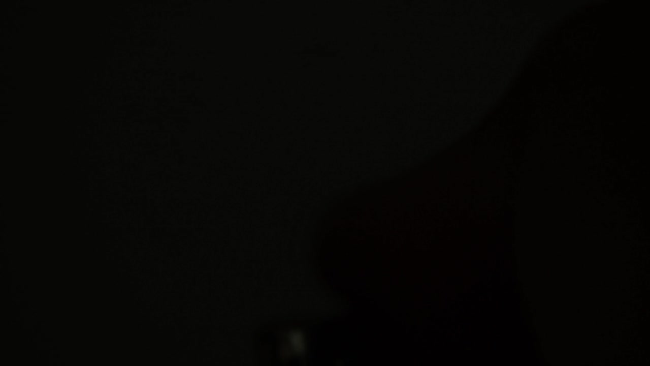 Close-up shot of a hand repeatedly flicking a lighter on and off